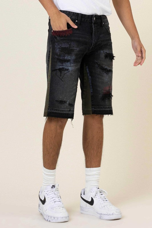 MULTI CAMO PANELED  RELEASED HEM DENIM SHORTS